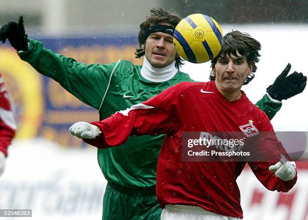 Sergei Kovalchuk of Spartak Moscow competes for the ball with Vitali Astafiev of Rubin Kazan during the Football Russian League Championship match on...