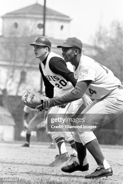 Firstbaseman Ernie Banks of the Chicago Cubs takes his position as Richie Hebner of the Pittsburgh Pirates leads off during a game in 1970 at Forbes...