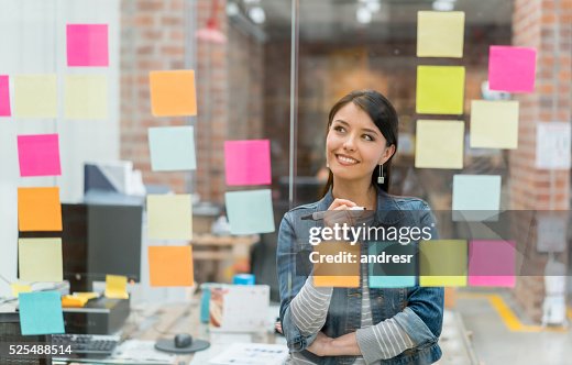 Woman thinking of ideas at the office Woman thinking of ideas at the office