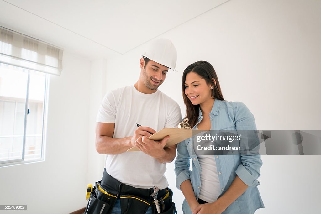 Contractor talking to a woman at home