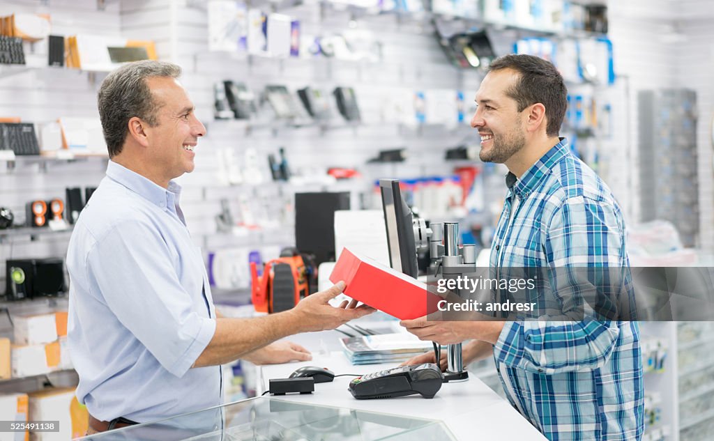 Man shopping at a tech store