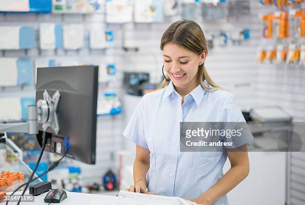 woman working at an electronics store - electrical shop stock pictures, royalty-free photos & images