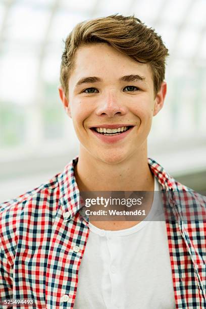 portrait of smiling teenage boy - teen boys stock pictures, royalty-free photos & images