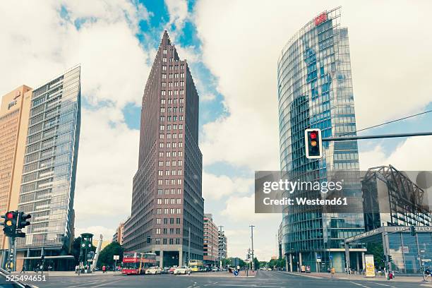 germany, berlin, high-rise buildings of renzo piano, hans kollhoffand deutsche bahn tower at potsdam square - yellow light stock pictures, royalty-free photos & images