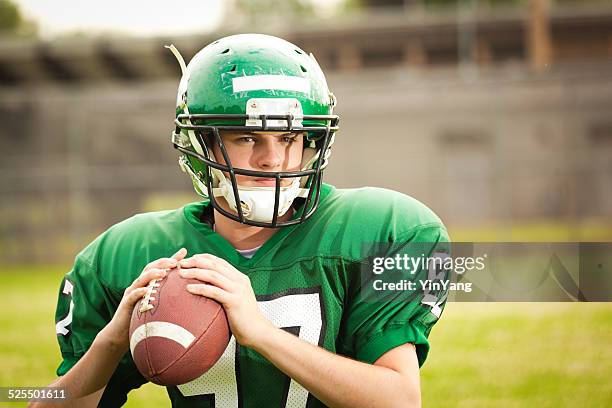 american football player, high school quarterback ready to throw pass - high school football stock pictures, royalty-free photos & images