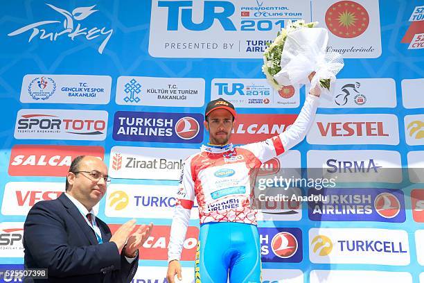 Remy di Gregorio of Delko Marseille Provence KTM poses on the podium with the red jersey for winning the King of the Mountain after the Alanya -...