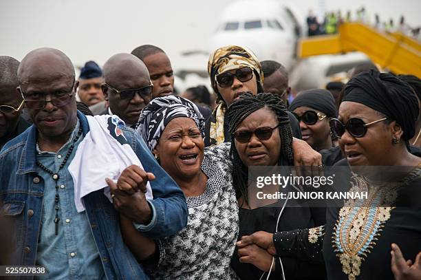 Late Congolese rumba star Papa Wemba's wife Maria Rosa , also known as Amazone, and his daughter arrive at Ndjili airport in Kinshasa on April 28...