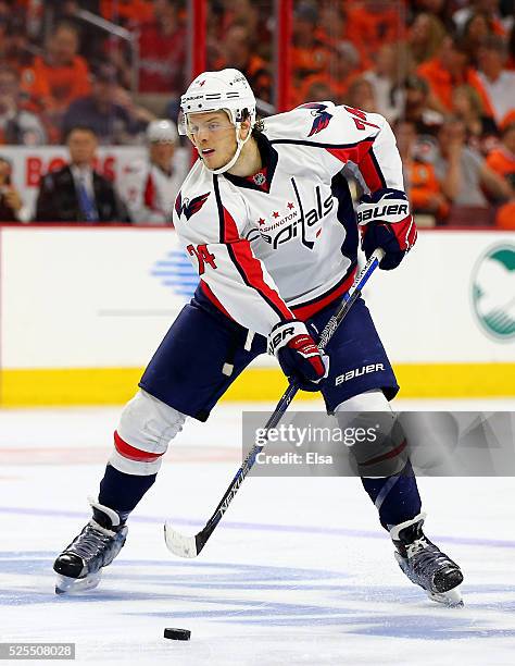 John Carlson of the Washington Capitals takes the puck in the third period against the Philadelphia Flyers in Game Three of the Eastern Conference...