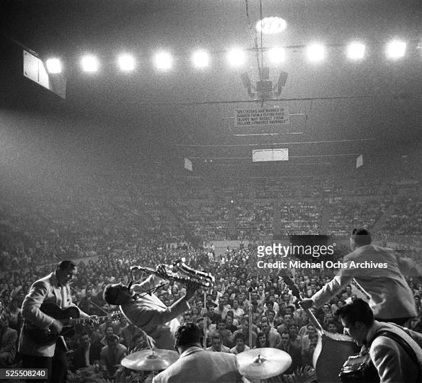 Bill Haley and his Comets perform onstage at the Sports Arena on April 20, 1956 in Hershey, Pennsylvania.