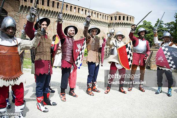 The WSBK riders celebrate the victory during the pre-event "Historic Duel and Archery Shooting Competition" at the Rocca Sforzesca in Imola during...