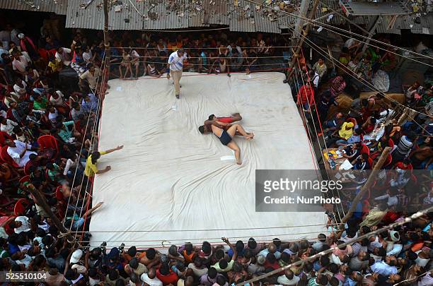 Streetside wrestling competition organised by the merchants of Burrabazar on the eve of Diwali festival in Burrabazar on 24th October 2014, in...