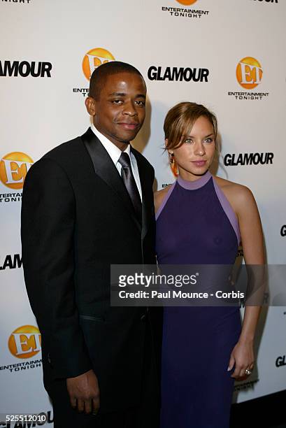 Dule Hill and fiancee Nicole Lyn arrive at the "Glamour" magazine-sponsored "Entertainment Tonight" party celebrating the 55th Annual Emmy Awards at...
