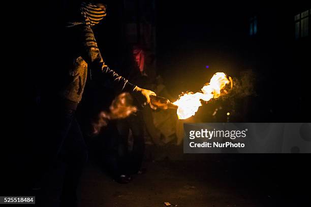 Protester with molotov cocktail during clashes with police in the Alevi enclave of Okmeydani on Istanbul on May 26, 2014.