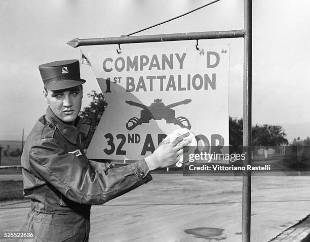 Elvis Presley poses for the camera during his military service at a US base in Germany.