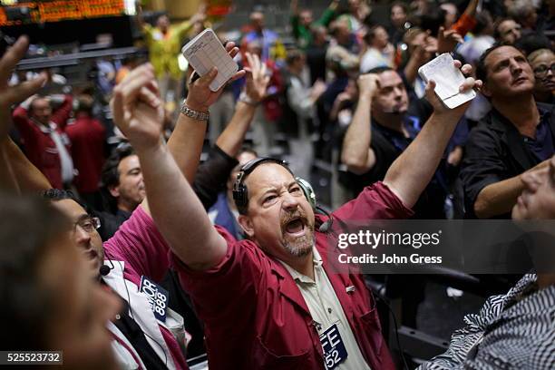 Trader reacts in the S&P futures pit at the CME group in Chicago, September 13 after the Federal Reserve launched another aggressive stimulus program...
