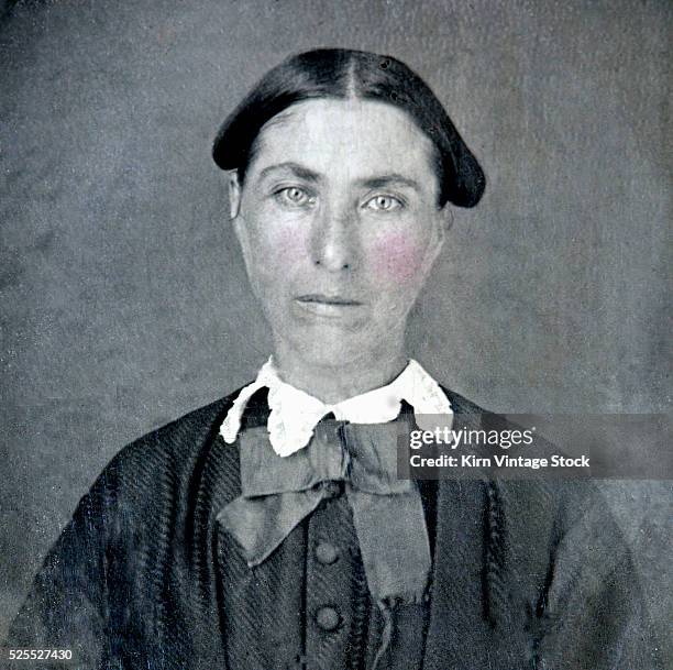 Nineteenth century tintype portrait of a woman with tinted cheeks.