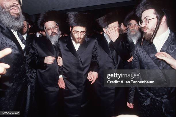 Lubavitcher Rabbi Yosef Horowitz is escorted to the Chupah for his wedding to the daughter of a Grand Lubavitcher Rabbi outdoors in Brooklyn, New...