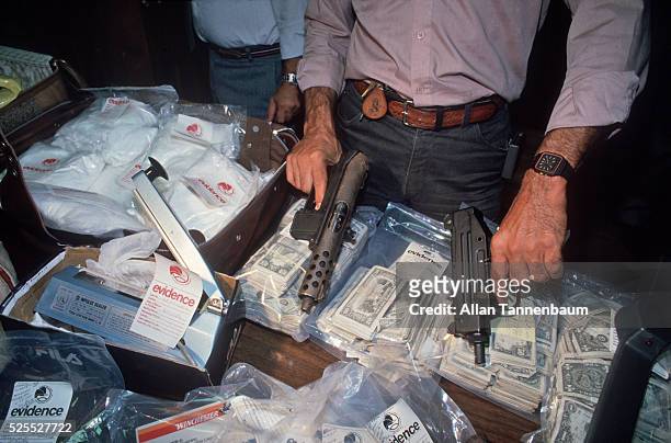 Seizure of 35 kg of heroin, machine guns, money, furs, and jewelry, New York, New York, August 22, 1986.