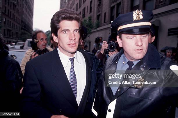 John F Kennedy Jr at the apartment house after the death of his mother, Jackie Kennedy Onassis, New York, New York, May 20, 1994.