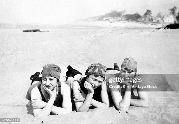 Three flappers enjoy a day at the beach, ca. 1924.