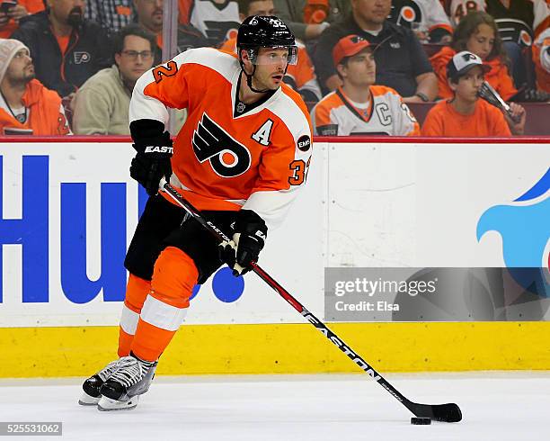 Mark Streit of the Philadelphia Flyers takes the puck against the Washington Capitals in Game Three of the Eastern Conference First Round during the...