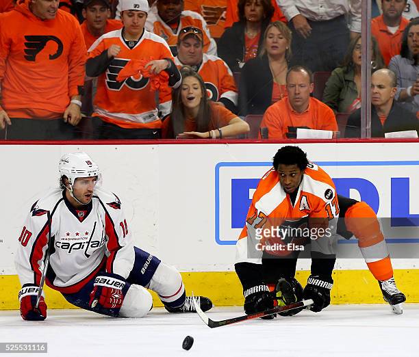 Mike Richards of the Washington Capitals and Wayne Simmonds of the Philadelphia Flyers collide in Game Three of the Eastern Conference First Round...