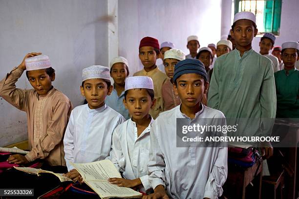 Young Muslim boys learn about Islam at a madrassa. A madrassa is an Islamic religious school. Students study the Koran, the teachings of Mohammed and...