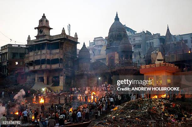 February 12, 2012 - The dead are burned on funeral pyres at Manikarnika Ghat, a cremation Ghat on the Ganges River at Varanasi. Known as the "Gateway...