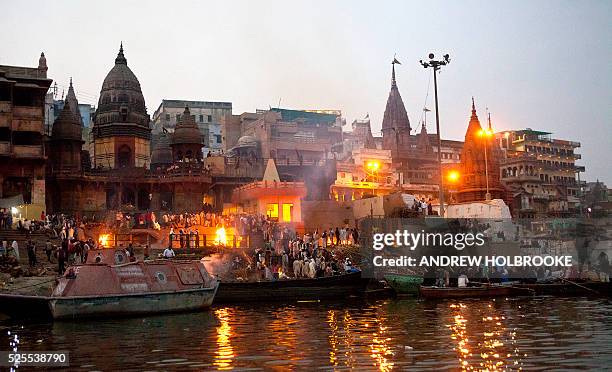 February 12, 2012 - The dead are burned on funeral pyres at Manikarnika Ghat, a cremation Ghat on the Ganges River at Varanasi. Known as the "Gateway...