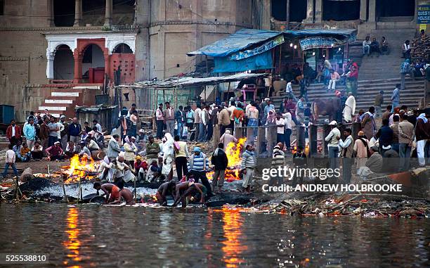 February 12, 2012 - The dead are burned on funeral pyres at Manikarnika Ghat, a cremation Ghat on the Ganges River at Varanasi. Known as the "Gateway...