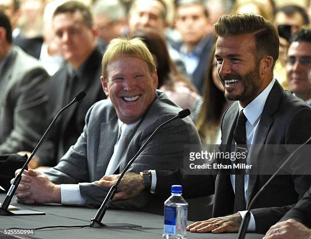 Oakland Raiders owner Mark Davis and former soccer player David Beckham laugh as they attend a Southern Nevada Tourism Infrastructure Committee...