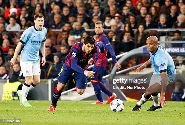 Vincent Company and Luis Suarez during the UEFA Champions League round of 16 match between FC Barcelona and Manchester City at Camp Nou Stadium on...