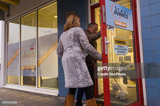 Residents of the town of Voorschoten can be seen voting at a railway station. In The Netherlands on Wednesday Dutch citizens and residents of voted...