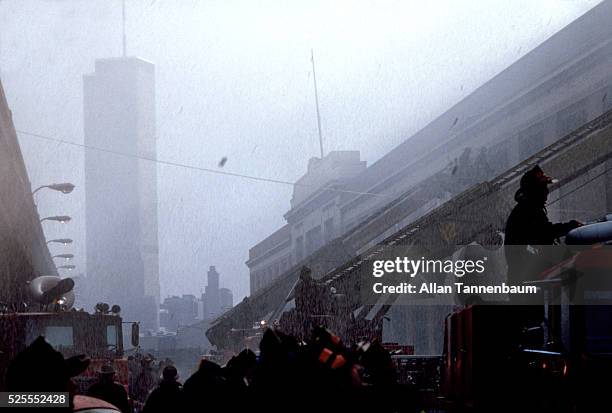 Fight a fire on a Hudson River pier with the WTC in the background, New York, New York, January 15, 1980.