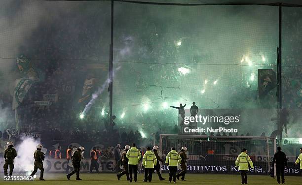 Clashes between riot police and PAO FC football fans, inside the stadium after the referee's decision to postpone the match. In Athens on November...