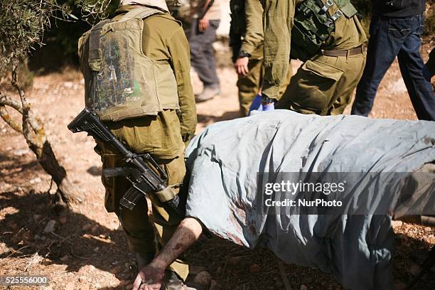 Israeli troops kill a Palestinian "Mohammed Assi" during clashes in the village of Bil'in near the West Bank city of Ramallah October 22, 2013....