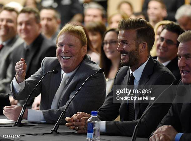 Oakland Raiders owner Mark Davis and former soccer player David Beckham laugh as they attend a Southern Nevada Tourism Infrastructure Committee...