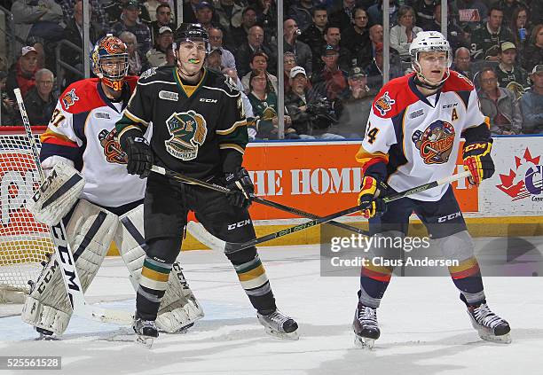 Matthew Tkachuk of the London Knights waits to tip a shot in front of Devin Williams of the Erie Otters during game Four of the OHL Western...