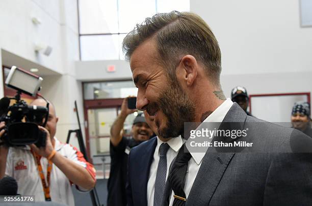Former soccer player David Beckham arrives at a Southern Nevada Tourism Infrastructure Committee meeting with Oakland Raiders owner Mark Davis at...