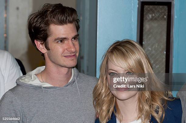 Andrew Garfield and Emma Stone of The Amazing Spider-man take part in the Be Amazing, Stand Up and Volunteer initiative at the Farragut House in...