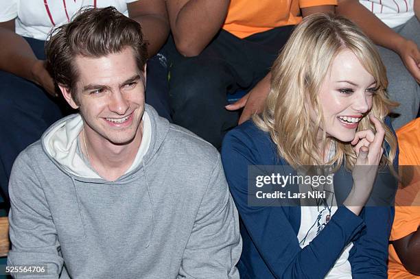 Andrew Garfield and Emma Stone of The Amazing Spider-man take part in the Be Amazing, Stand Up and Volunteer initiative at the Farragut House in...