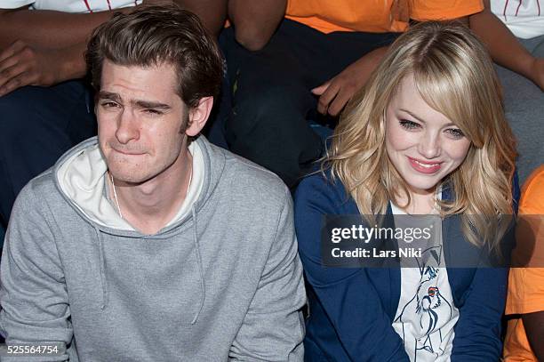 Andrew Garfield and Emma Stone of The Amazing Spider-man take part in the Be Amazing, Stand Up and Volunteer initiative at the Farragut House in...