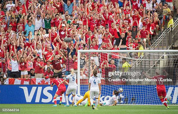 Christine Sinclair of team Canada scores Canada's first goal during 2015 women's World Cup Soccer in Vancouver during second round action between...