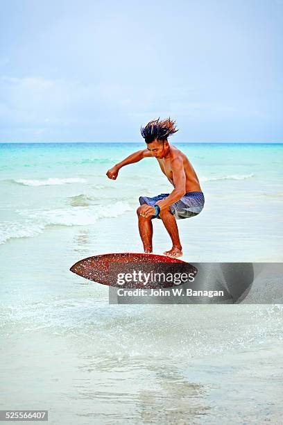 skim boarding, boracay, phillipines - boracay philippines stock pictures, royalty-free photos & images