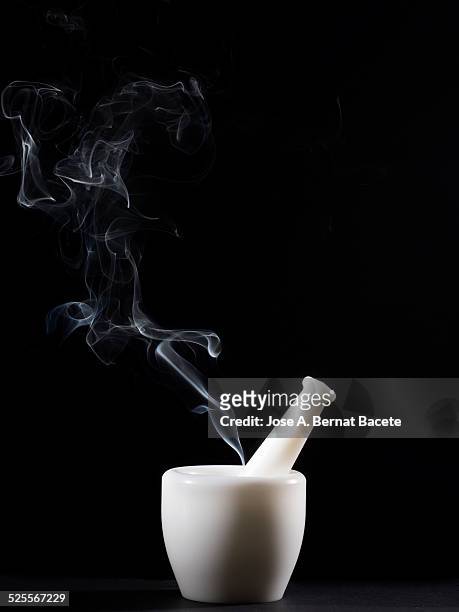 plastic pestle and mortar with smoke - fumes cooking stock pictures, royalty-free photos & images