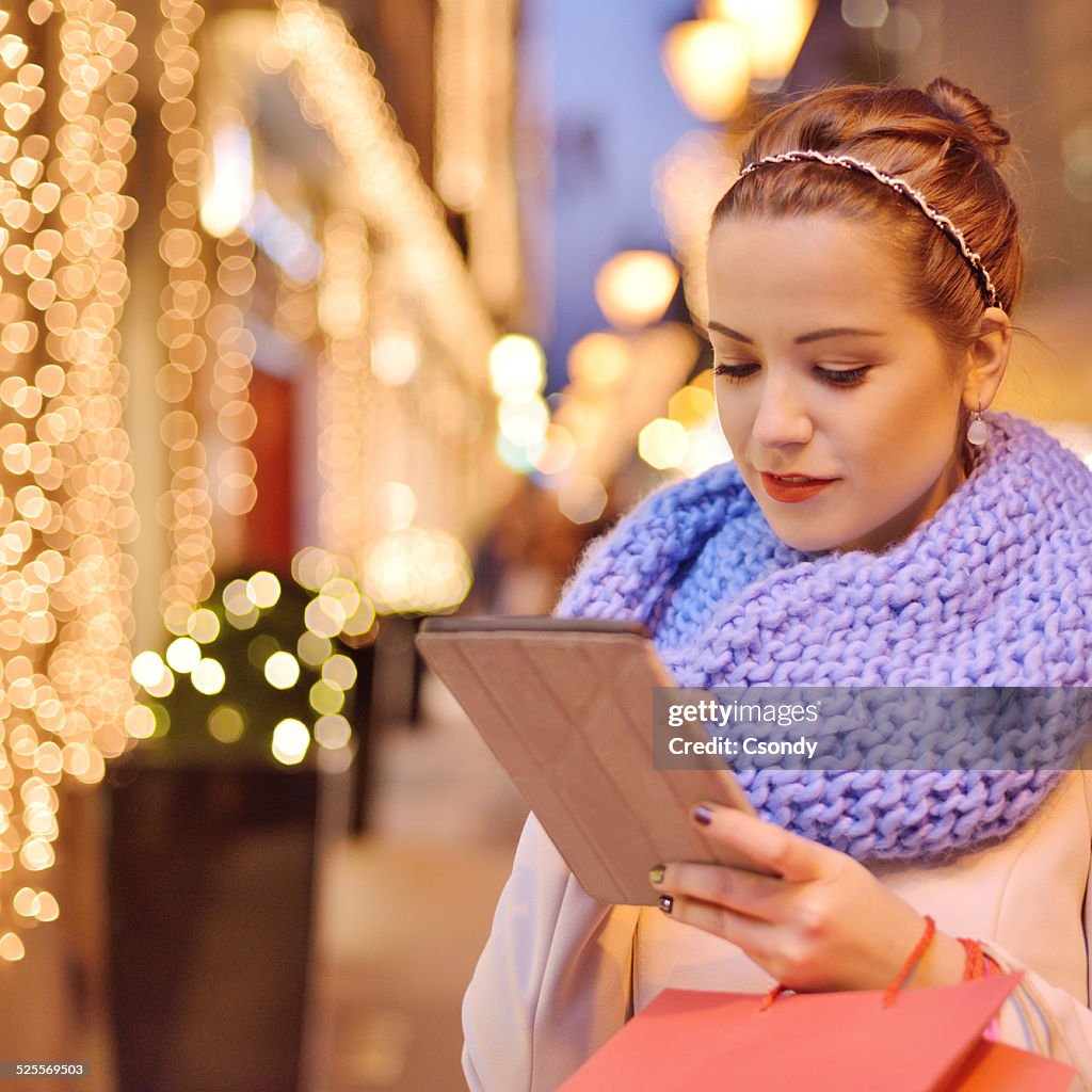 Young woman shopping with digital tablet