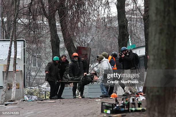 Protesters carry the corp of sniper fire victim