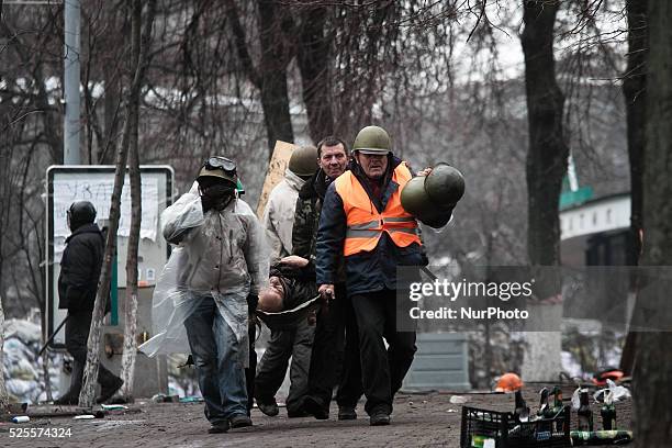 Protesters carry the corp of sniper fire victim