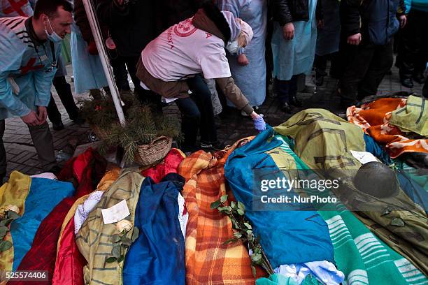 Doctor tries to identify the victims of the sniper fire