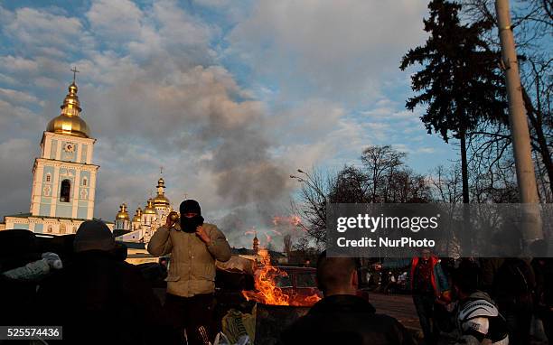 The protesters sits in front of the organized in churh field hospital for protesters, in Kiev.